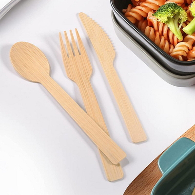 Il coltello eliminabile di bambù dell'insieme delle stoviglie di materia prima della coltelleria ecologica si biforca cucchiai